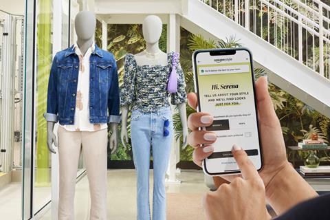 Customer in Amazon Style store holding up phone to scan item of clothing